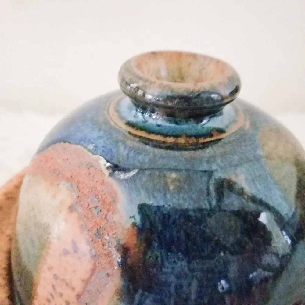 Pottery covered plate earth tones with blue